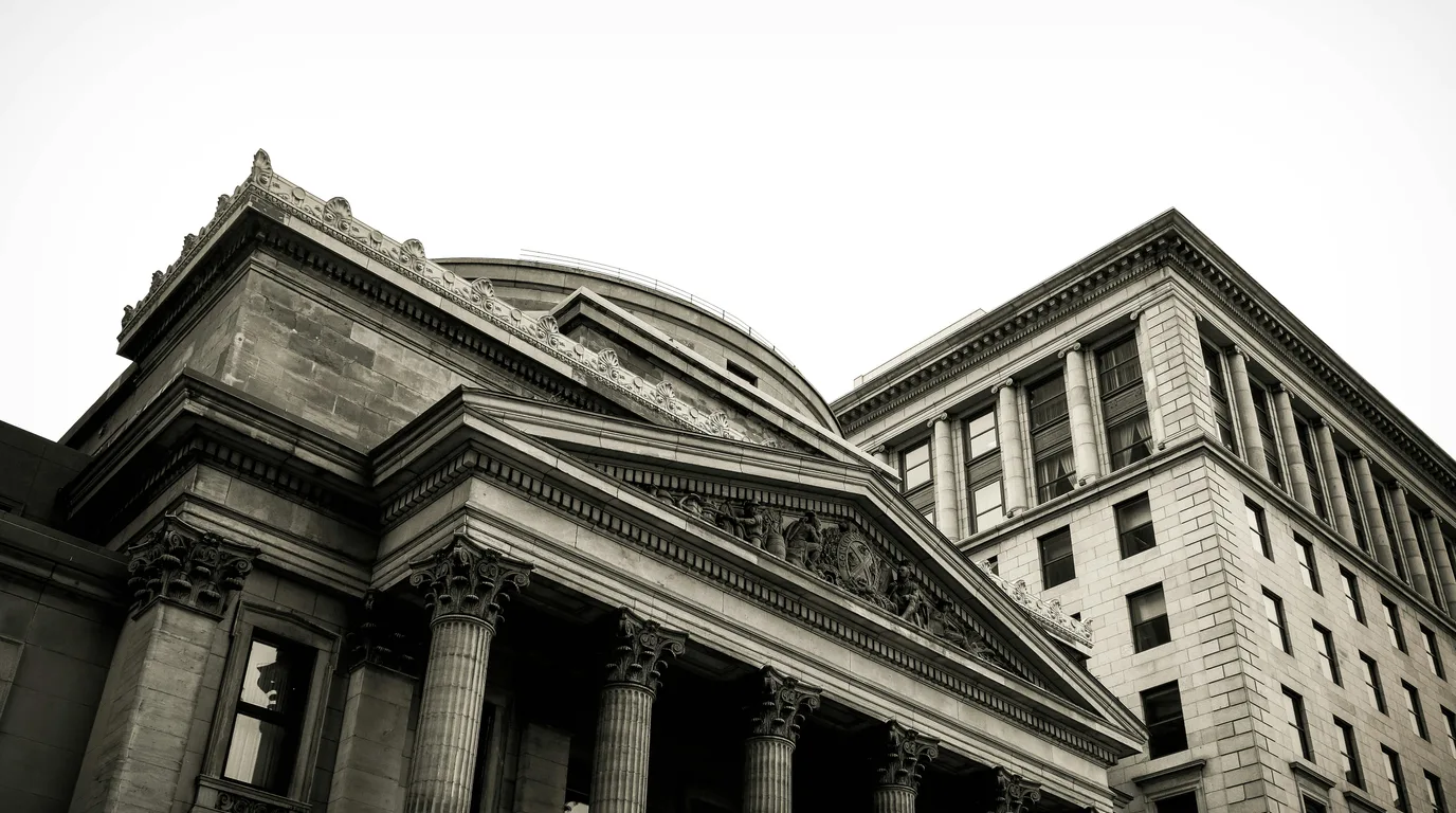 A columned neoclassical bank building photographed in black and white.